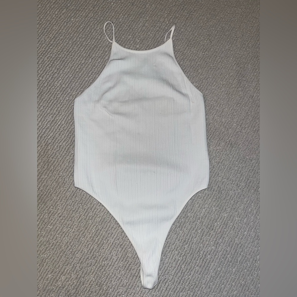 White ribbed body suit with cross back detail